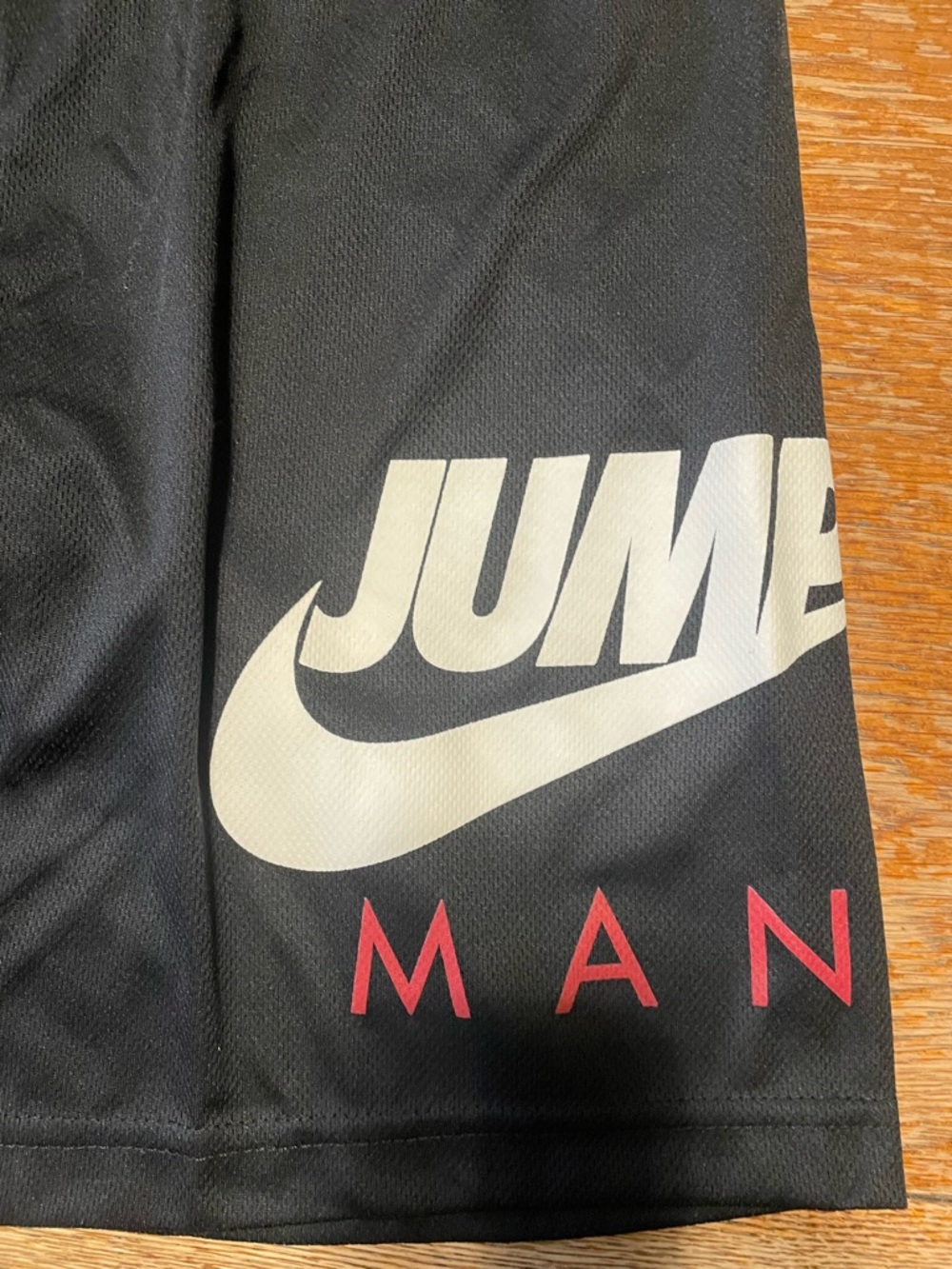 Nike Black Shorts with White Jumpman Swoosh and Red Lettering